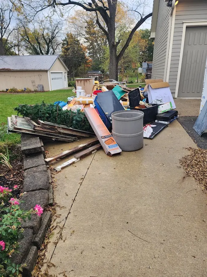 Dumpster being loaded with debris for Estate Cleanout Dumpster Rental in Viroqua